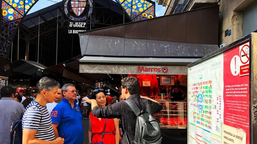 Barcelona: Street Food & Sightseeing Tour with Local Market - Entering La Boqueria, Barcelona’s great food market