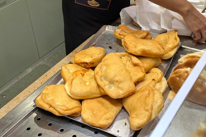 Eating Milan Street Food Tour with Guided Tasting and Sightseeing - The L.O.V.E. hand at Piazza Affari