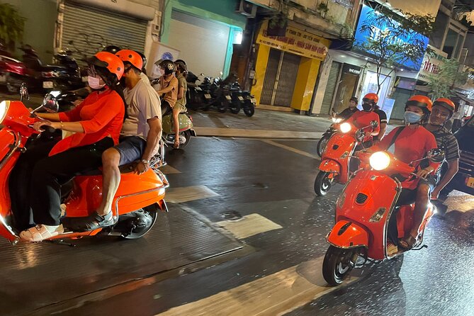 Female Riders Vespa Night Street Food + Train Street food 4 Hours - Long Bien, Ceramic Road, and the city after sunset