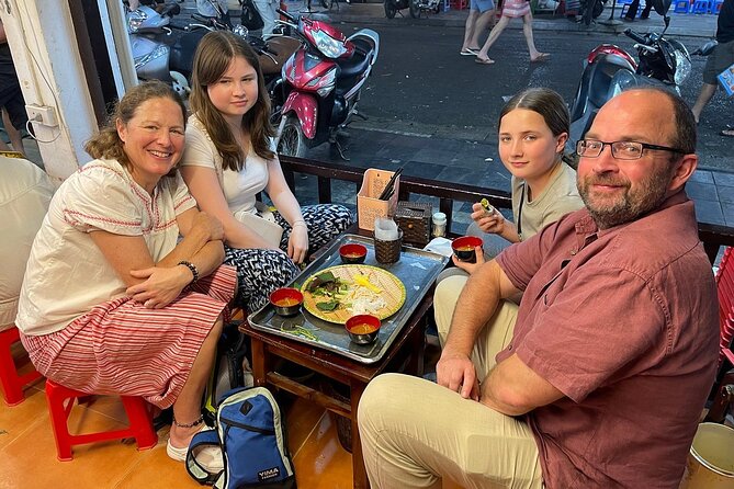 Hanoi Street Food Adventure: Train Street & Local Delights - Watching the train from a cafe