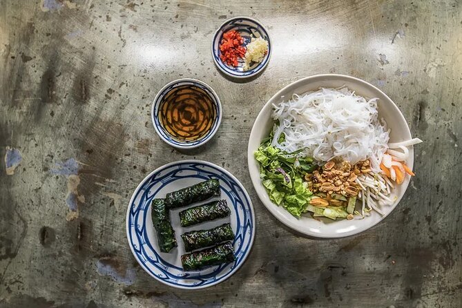 Hanoi Street Food Tour By Motorbike + Sightseeing SAFE & FUN - Train Street Cafe brings the evening to a memorable close