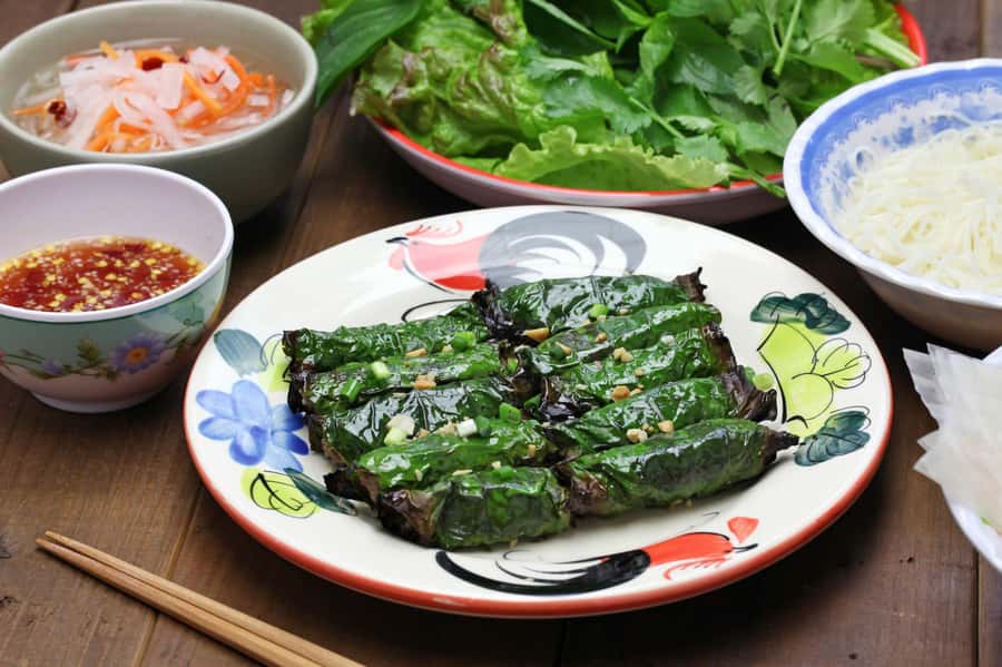 Ho Chi Minh: Saigon Street Food Walking Tour - Bo la lot: smoky beef wrapped in betel leaves