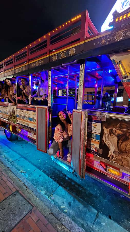 Medellin: Party Bus with DJ & Street Food Tastings - A moving start in El Poblado