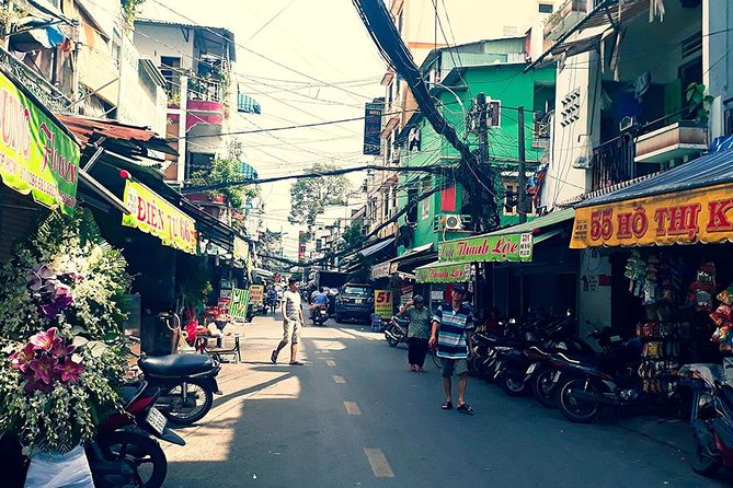 Morning Saigon Unseen+Street Food Tour with Ao Dai Riders Option - Vietnamese pancake, wild vegetables, and coconut juice