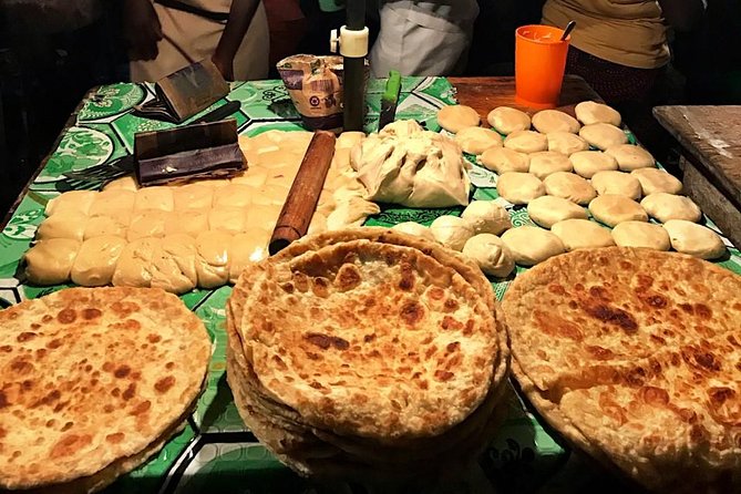 Nighttime Boda Boda Street Food Tour - Rolex wraps are the essential first taste