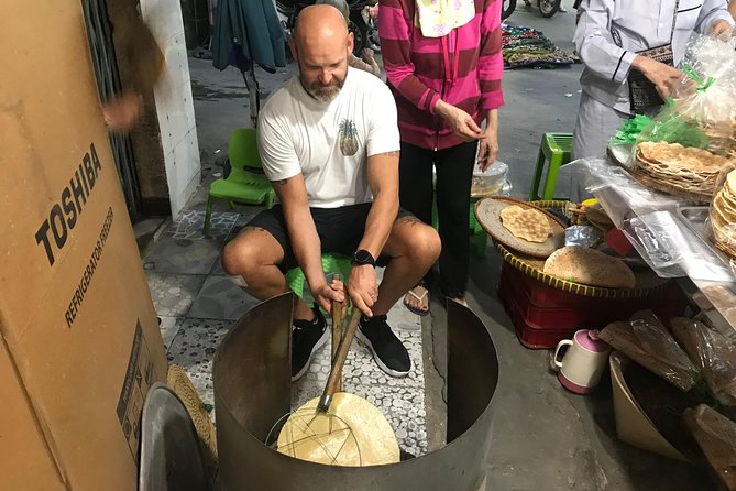 Private Ho Chi Minh Street Food Tour by Motorbike with Ao Dai Female Rider - Vietnamese pizza at Ho Thi Ky Flower Market