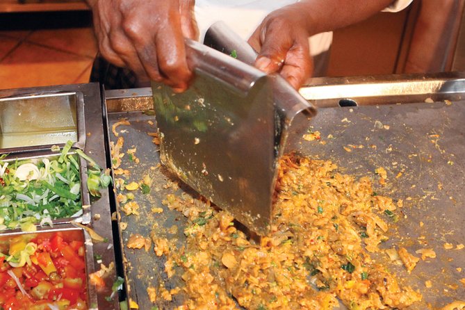 Private Night Tour in Colombo with Street Food Tasting - Gangaramaya Temple mixes religious life with unusual detail
