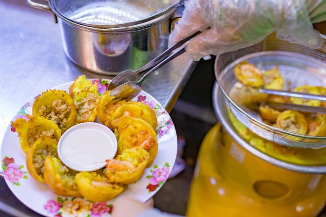 Private Street Food Evening Walking Tour in Ho Chi Minh City - Bo la lot, noodles, and seafood streets