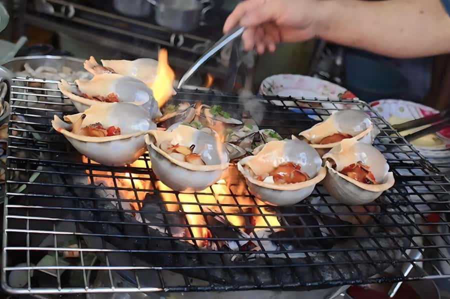 Saigon: Best Price Authentic Walking Street Food Tour - Drinks, taxis, and the walking pace