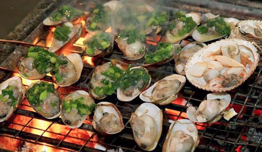 Saigon: Best Price Authentic Walking Street Food Tour - Beef wrapped in betel leaf and fresh spring rolls