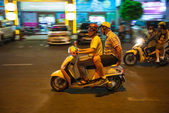 Saigon Night Street Food and City Tour on Scooter - A short night ride through several districts