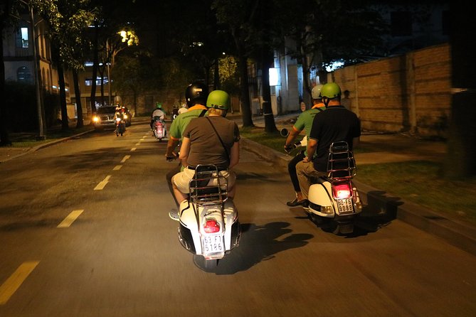 Saigon Vespa By Night Street Food Tour 4,5 Hours - Two restaurants, local food, and seafood