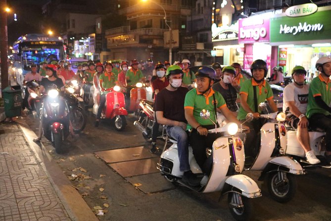 Saigon Vespa By Night Street Food Tour 4,5 Hours - Ending at a music bar in District 1