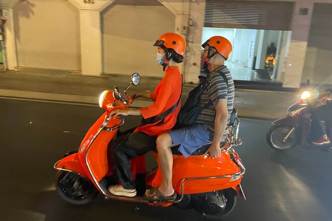Saigon Vespa By Night Street Food With Female Riders Ao Dai - Starting at 6 pm with an áo dài-clad driver