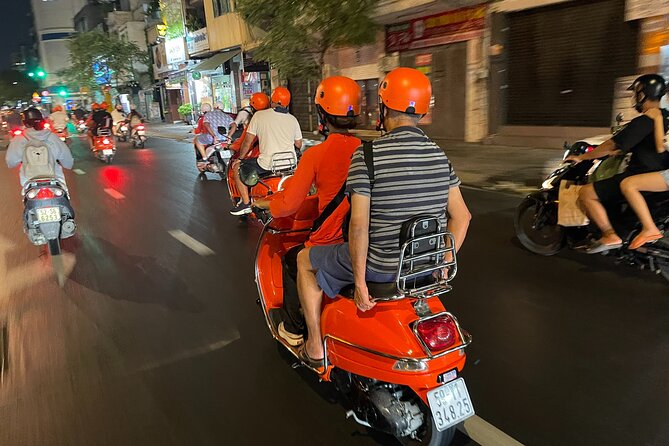 Saigon Vespa By Night Street Food With Female Riders Ao Dai - First stop: seafood, local drinks, and a proper start to dinner