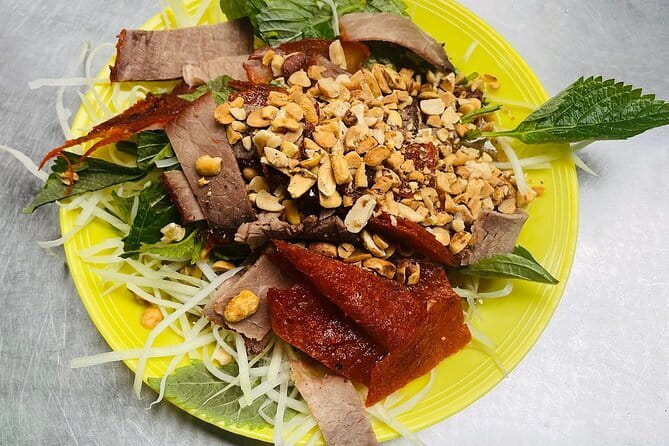 Small group Hanoi Street Food Tour with visit Train Street - Steamed pancakes, noodle soup, and a changing menu