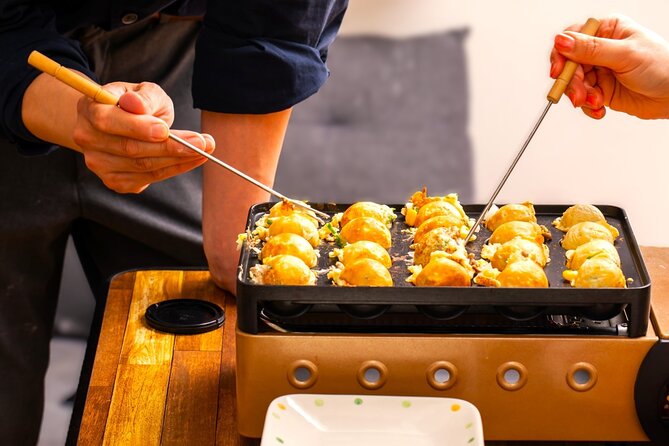 Takoyaki making experience ~Japan's popular street food~ - Turning batter into takoyaki in Kabukicho