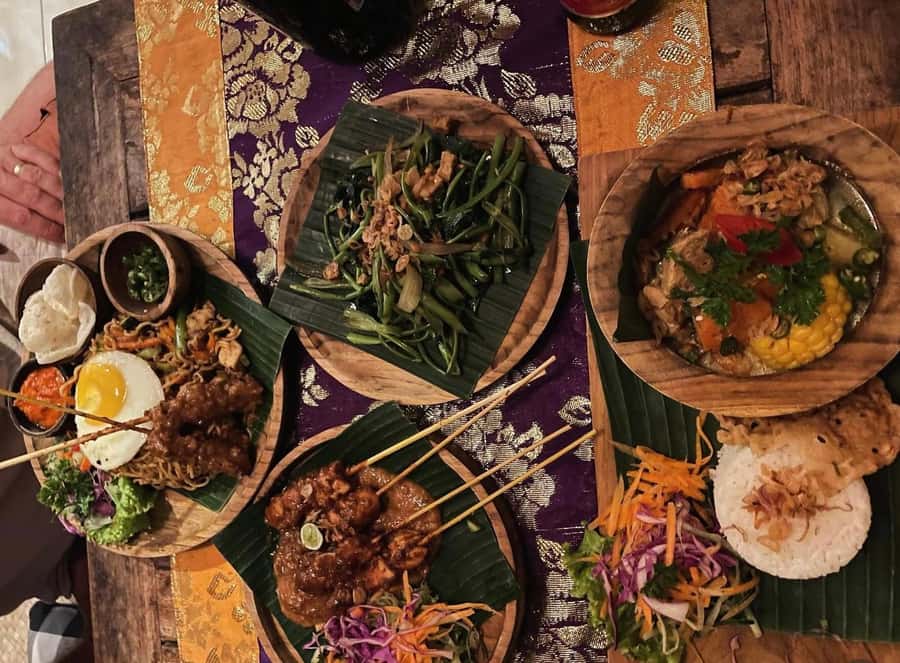 Ubud: Gianyar Night Market Food Tour with up to 17+ Tastings - Nasi campur turns many tastes into one plate