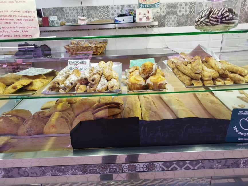 Valencia: Street Food Tour including Paella & Tapas Tasting - Tostada, pastries, tapas, and the paella finish
