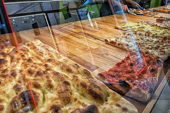 Vegan Street Food Tour in Rome - Ancient ruins inside a pizzeria