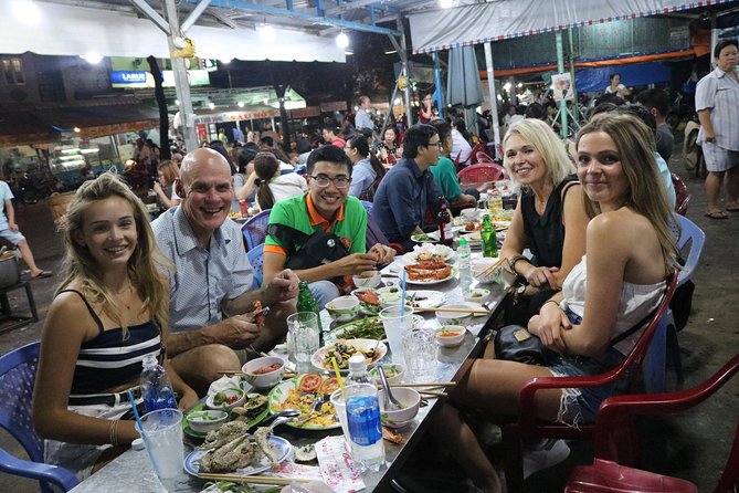 Vespa Saigon By Night Street Food Tour - Seafood and a local restaurant atmosphere